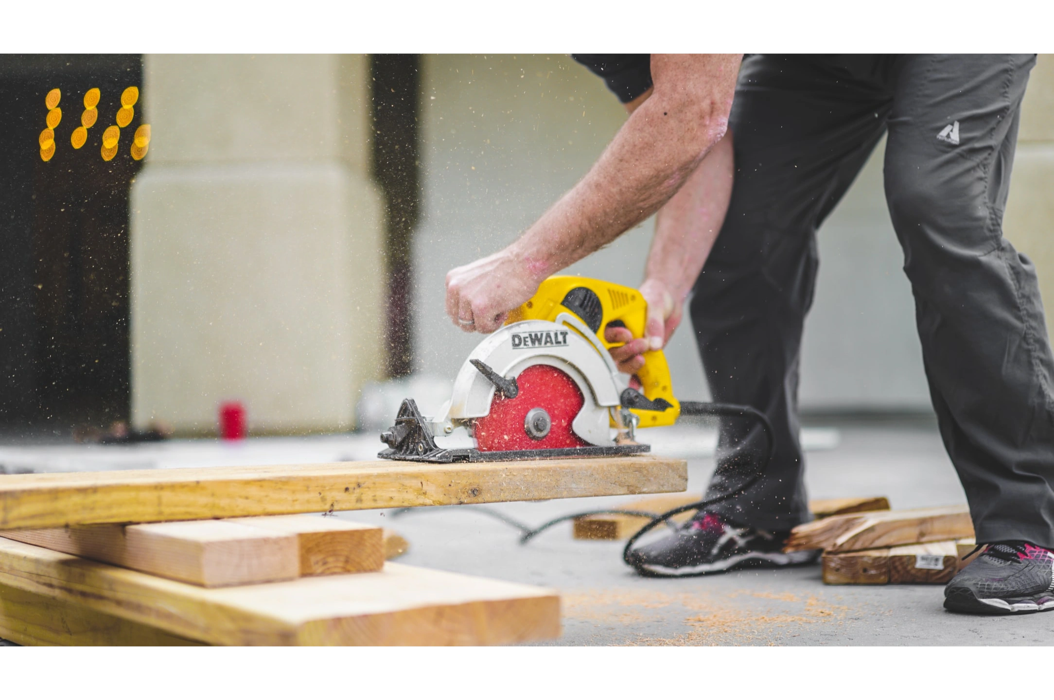 Carpenter using a circular saw on a job site